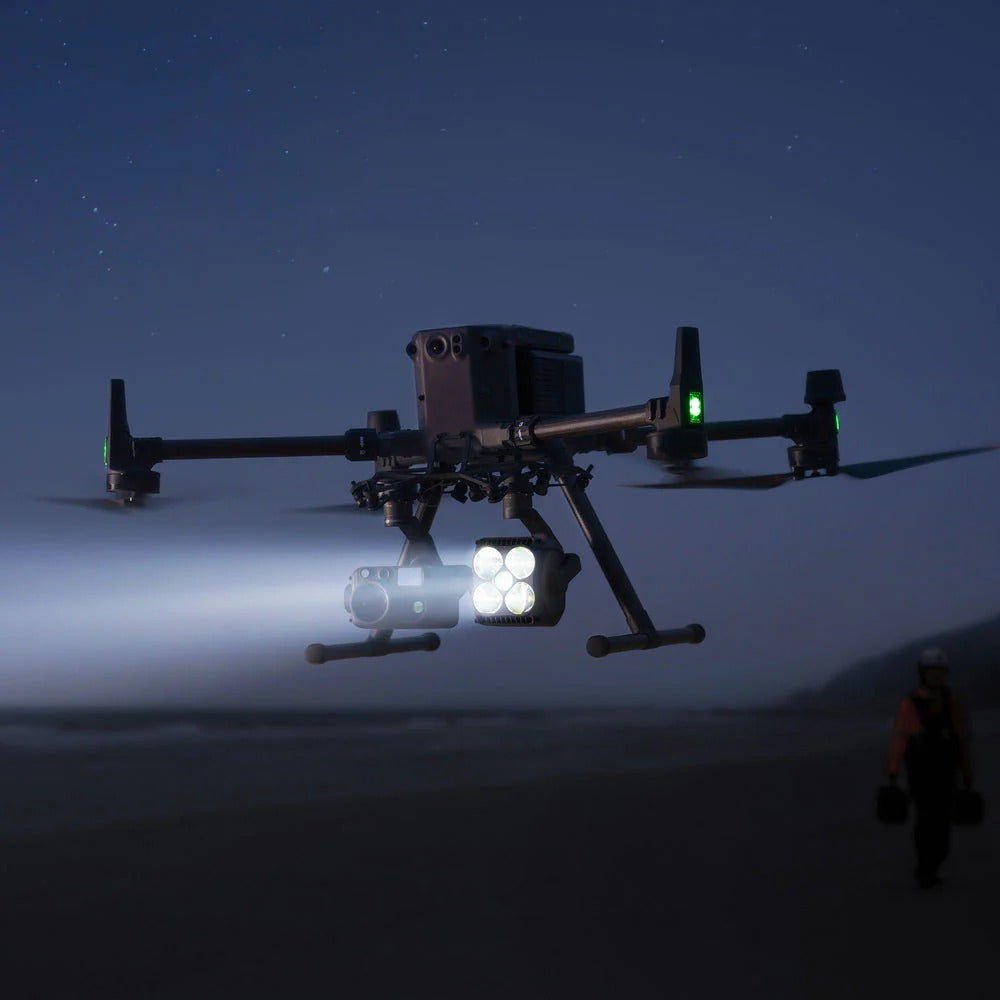 DJI Matrice 350 RTK Drone with lights flying in the night sky