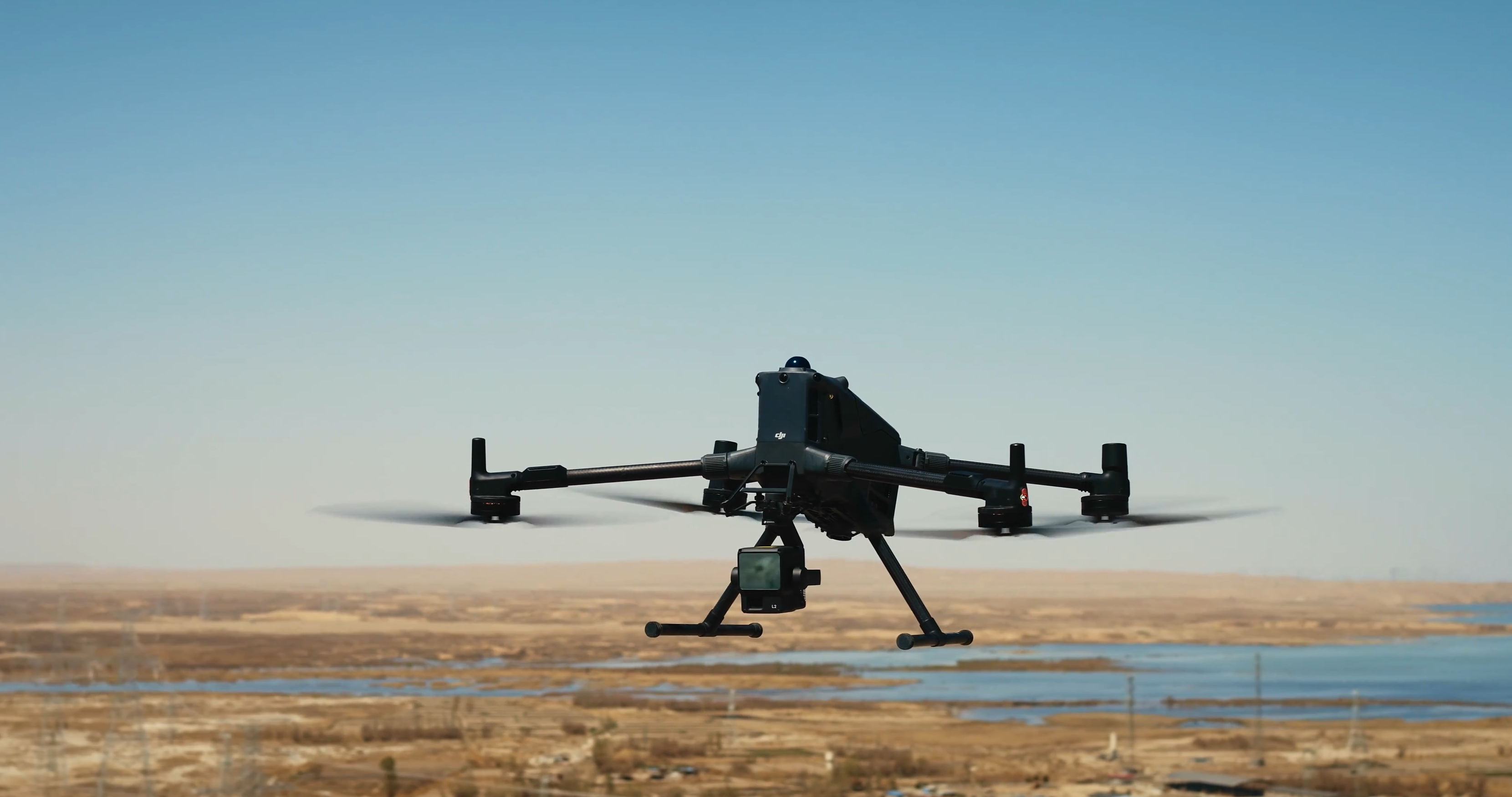 Drone on a sandy surface with clear sky